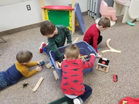 a group of boys playing with toys