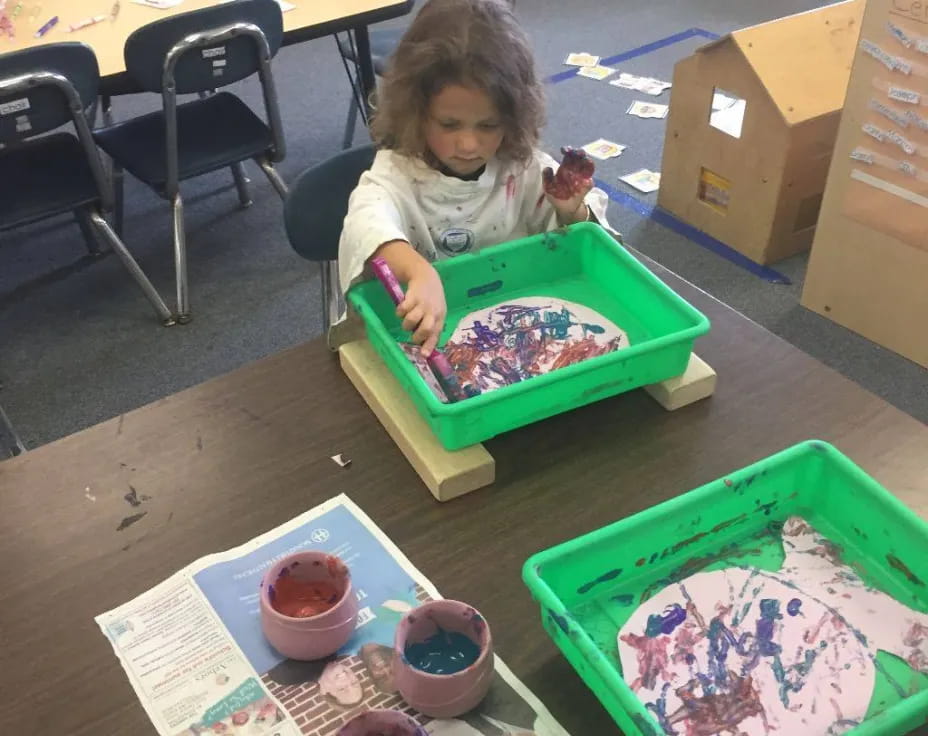 a child sitting at a table