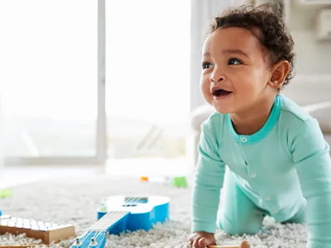 a baby sitting on the floor