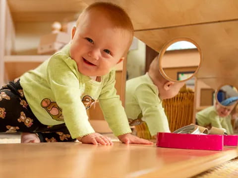 a baby crawling on a table