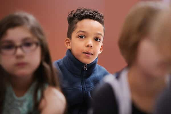 a boy looking at a person