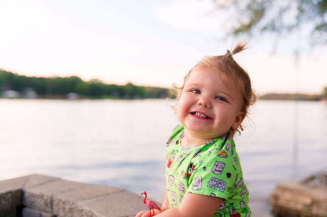 a child standing on a dock