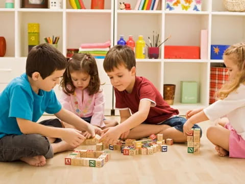 a group of children playing with toys