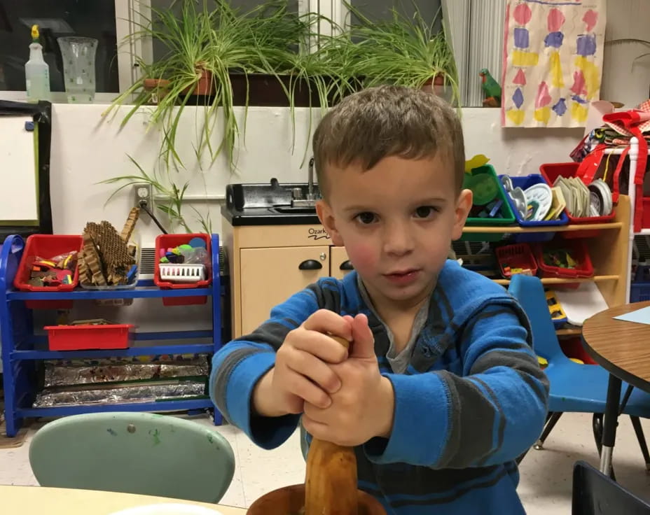 a boy sitting at a table