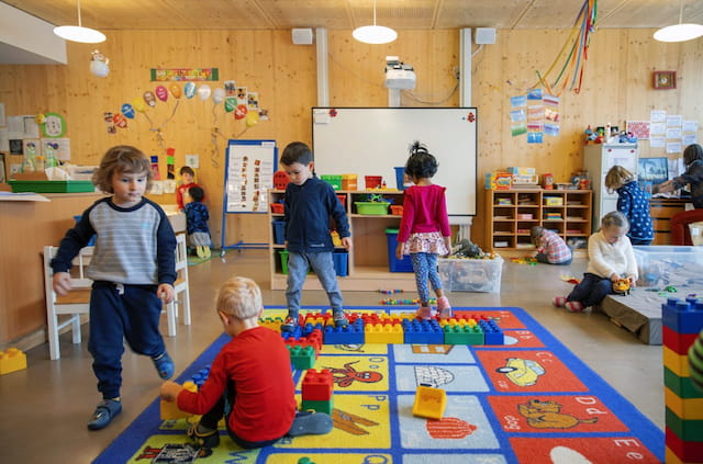 children playing with toys in a classroom