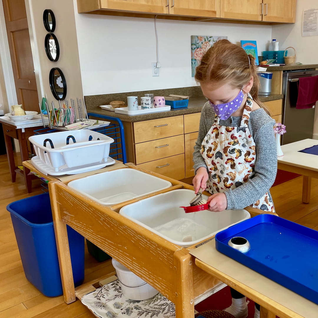 a girl painting a table