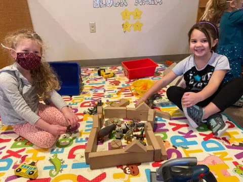 a group of children playing with toys