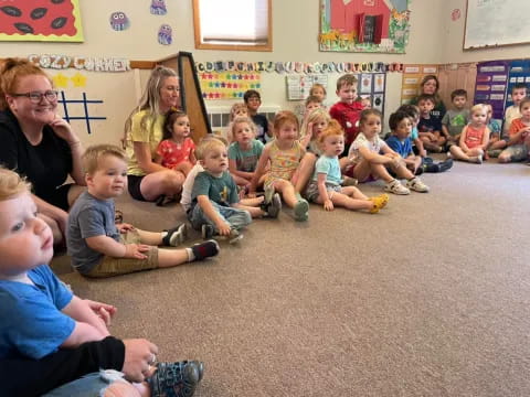 a group of children sitting on the floor