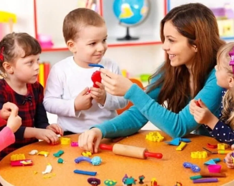 a person and several children playing with toys