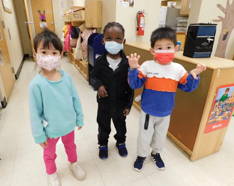 a group of children wearing clothing