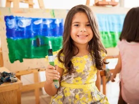 a girl holding a bottle