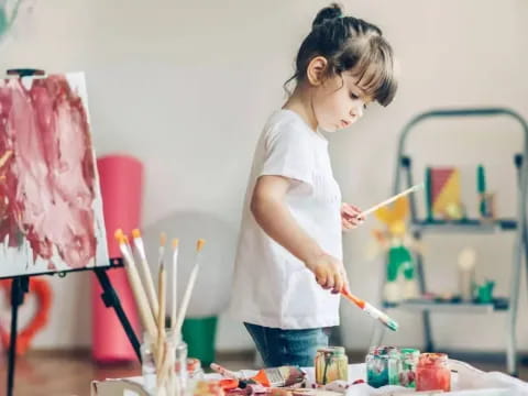 a young girl painting