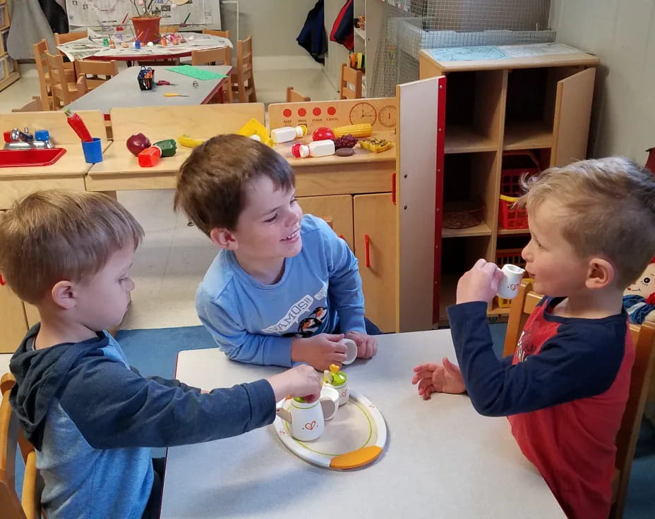 a group of boys playing with toys