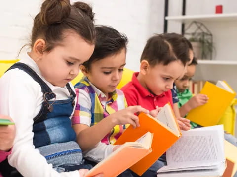 a group of children reading books