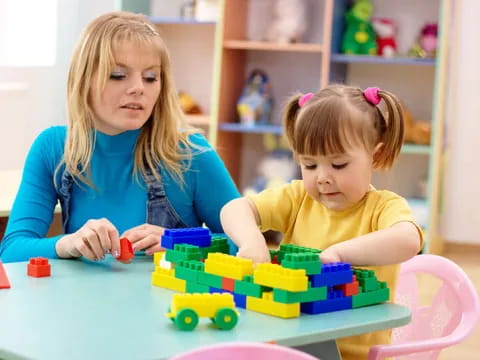 a couple of children playing with toys