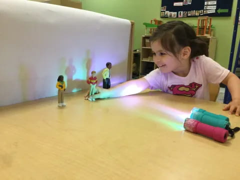 a girl playing with toys