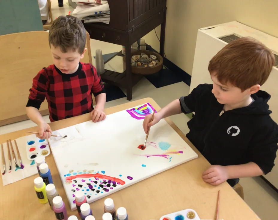 a couple of boys playing with toys