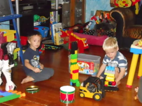 a couple of kids playing with toys