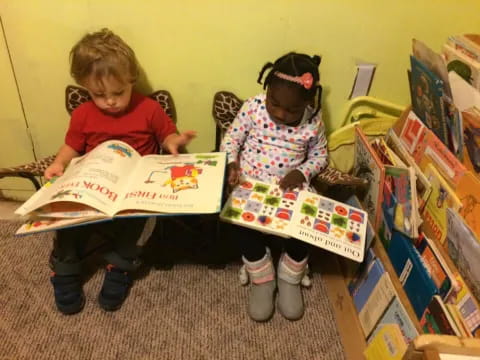 a couple of children reading books