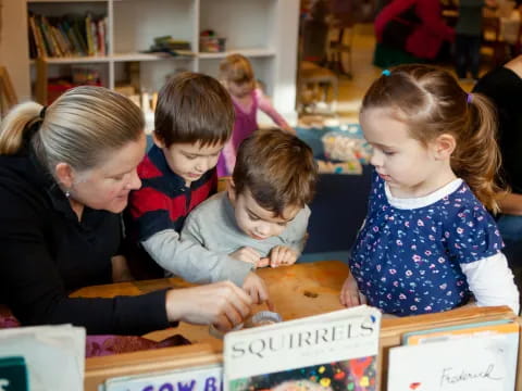 a group of children sitting at a table