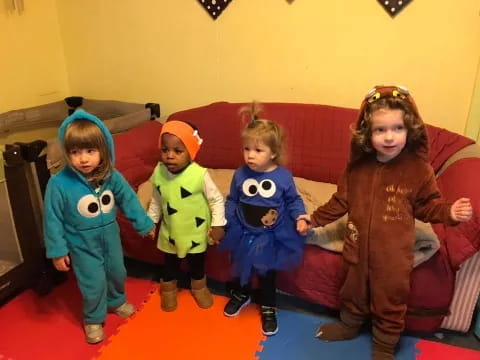 a group of children sitting on a couch