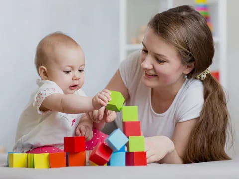 a person holding a baby