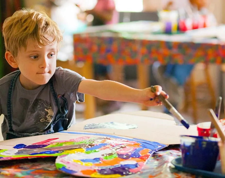 a young boy painting