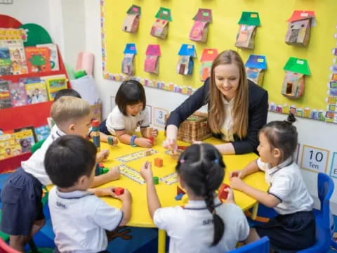 a person teaching children in a classroom