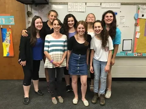 a group of women posing for a photo