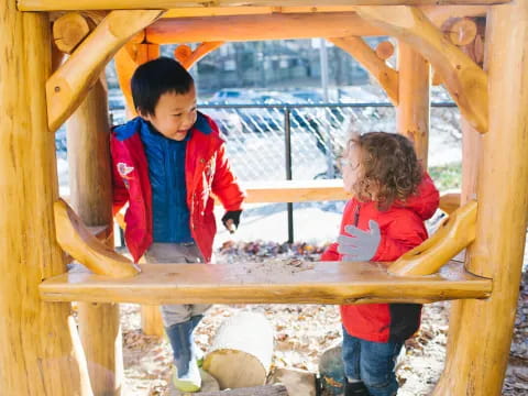 children playing on a wooden structure