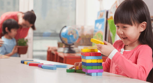 a group of children playing with toys