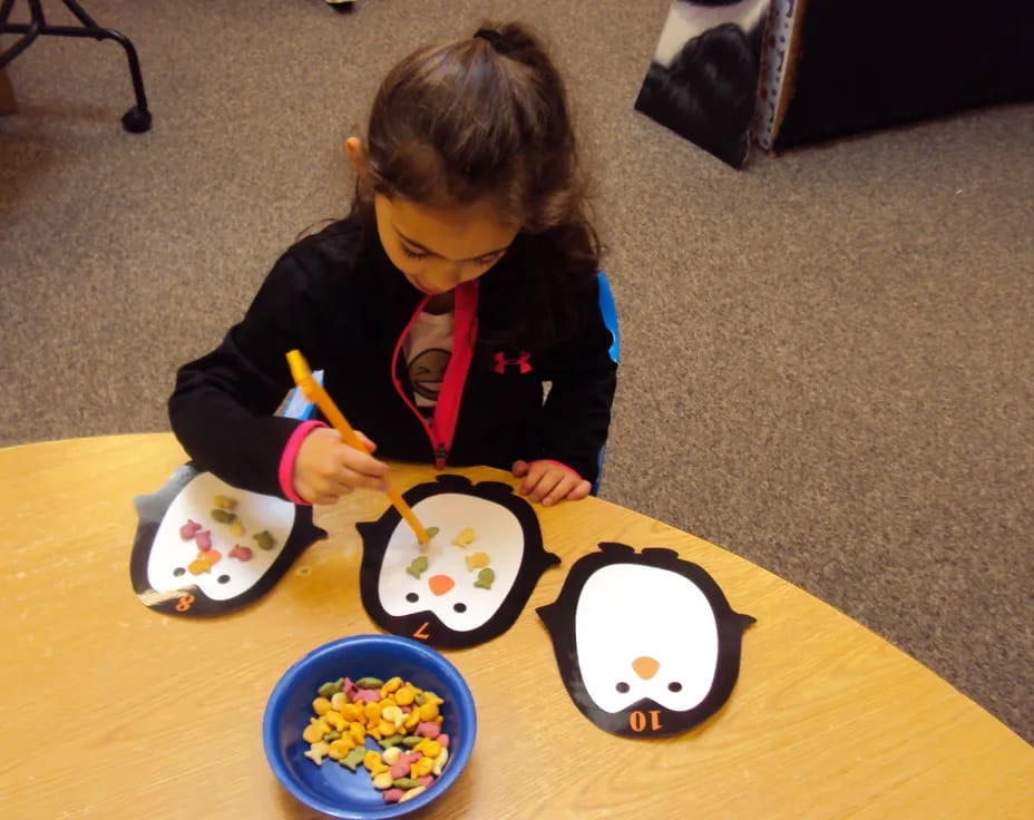 a girl painting on a table