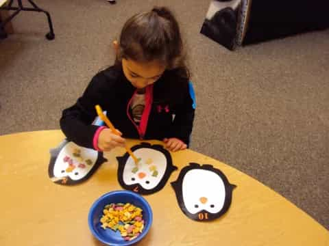 a girl painting on a table