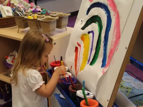 a young girl painting