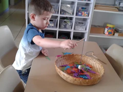 a boy playing with a toy