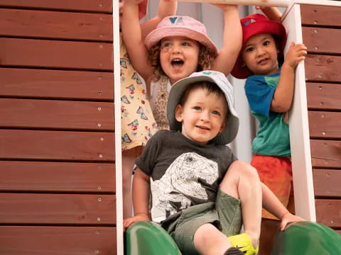 a group of children sitting on a bench