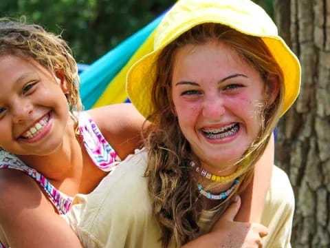 a couple of girls smiling