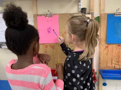 a few young girls painting
