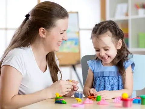 a woman and a child playing with toys