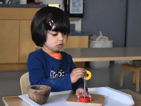 a child painting on a table