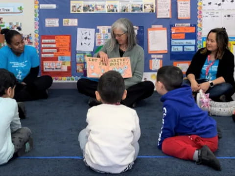 a person teaching children in a classroom