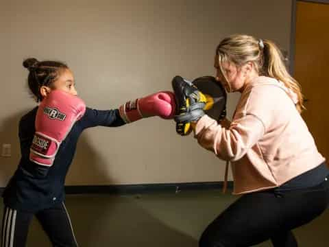 a woman punching another woman