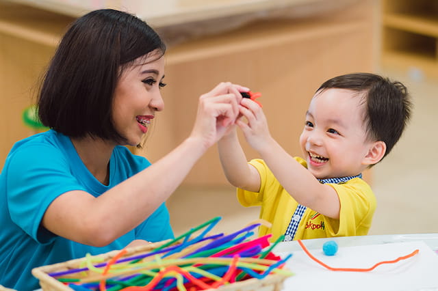 a person and a child painting