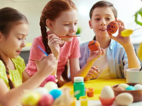 a group of children painting