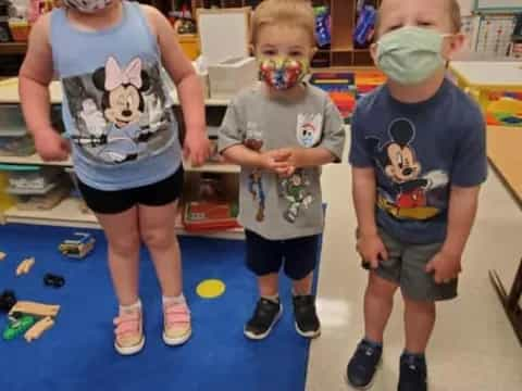 a group of children wearing masks