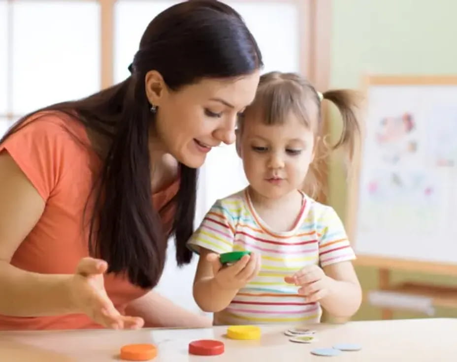 a person and a child playing with toys