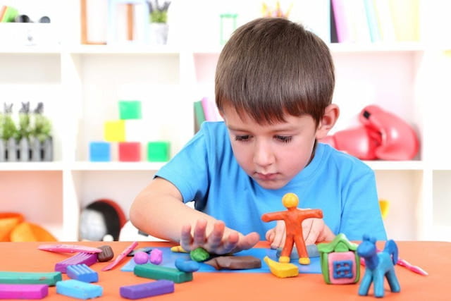 a boy playing with toys