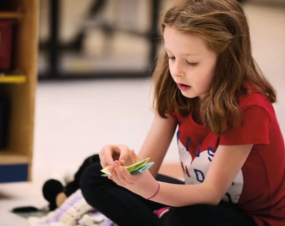 a girl sitting on the floor