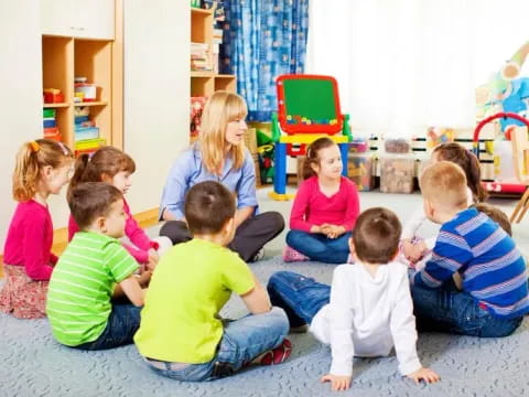 a group of children sitting on the floor