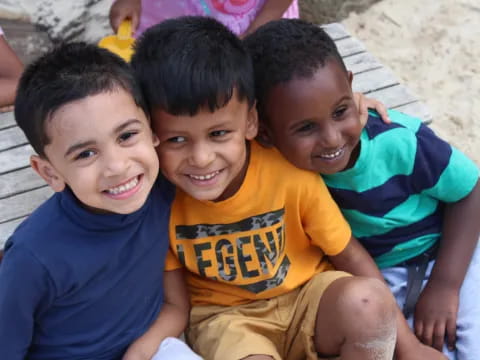 a group of boys smiling